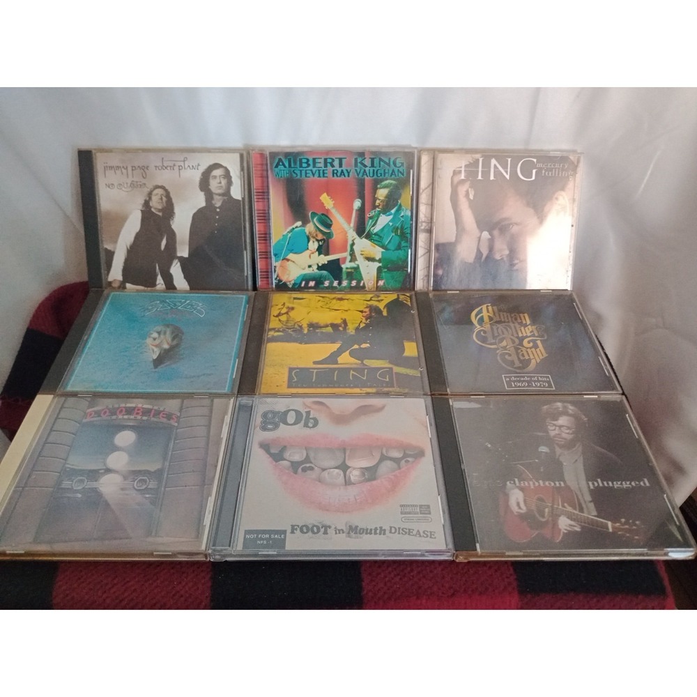 Lot of 9 CD's Stevie Ray Vaughan, Sting, The Eagles, Doobie Brothers, Page Plant